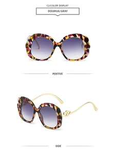 Detail of tortoise frame sunglasses with wavy edges and gold heart hollow temples