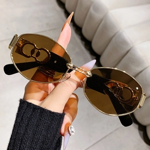 Fashionable punk polygon sunglasses with vintage oval tea lenses and gold metal cut-out temples