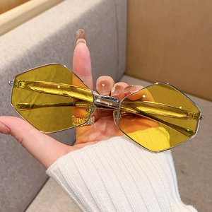 Retro geometric sunglasses with silver metal frames and vibrant yellow lenses