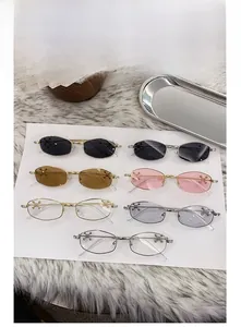 Flat lay of multiple polygonal metal sunglasses with star decor and colorful lenses