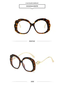 Detail of tortoise shell oval frames with wave edges and golden heart metal temples