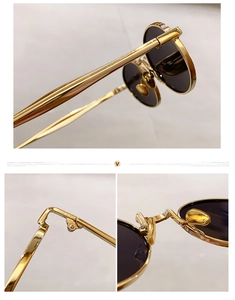 Detail view of oval metal sunglasses showing gold hinge and integrated nose pads