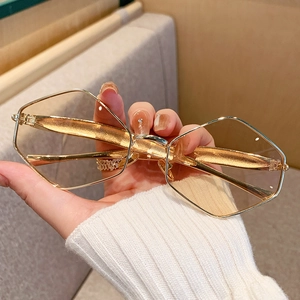 Fashionable golden metal geometric sunglasses with light yellow transparent lenses