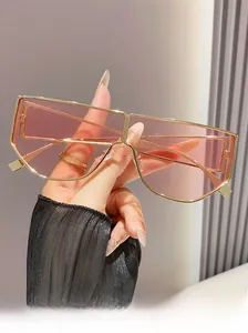 Detail of light gold metal oversized sunglasses with pink purple transparent lenses