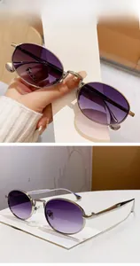 Detail of oval metal frame sunglasses with purple gradient lenses and silver finish