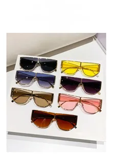 Flat lay display of colorful oversized metal sunglasses in seven trendy vibrant lens tints