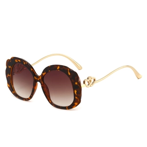 Fashionable leopard print oversized sunglasses with gold double heart metal temple detail
