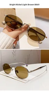 Close-up of oval sunglasses B869 with bright nickel metal frame and light brown lenses