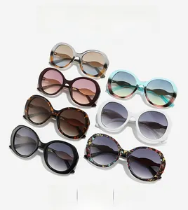 Close-up of stylish oversized sunglasses in tortoise, marble, and solid colors
