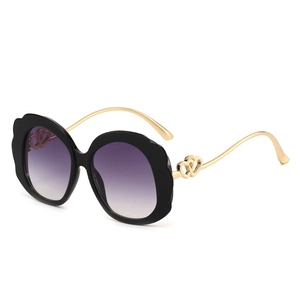 Fashionable oversized oval scalloped sunglasses with purple gradient lenses and heart metal temples