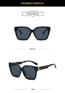 Front and side views of oversized black square sunglasses with broad gold temple accents