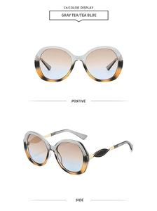 Detail view of gray tea and tea blue gradient oversized sunglasses with metallic temples