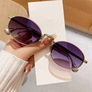 Chic oval sunglasses with silver metal frame and purple gradient lenses for a retro look