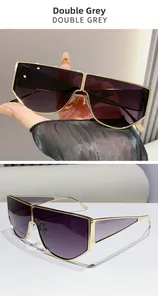 Detailed close-up of geometric gold metal frame sunglasses with double grey gradient lenses