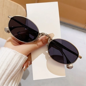 Retro oval metal sunglasses with silver frame and dark lenses for outdoor fashion styling
