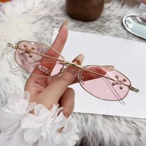 Fashion polygon sunglasses with pink gradient lenses and gold metal frame with rhinestones