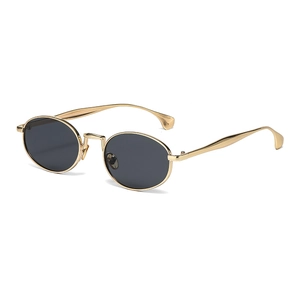 Stylish oval vintage sunglasses with gold metal frame and dark lenses on white background