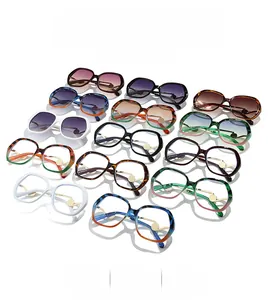 Close-up of retro oversized round sunglasses in tortoiseshell and gradient color frames