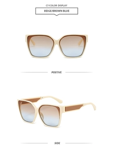 Detail view of square cat-eye sunglasses with beige frames and brown-blue gradient lenses
