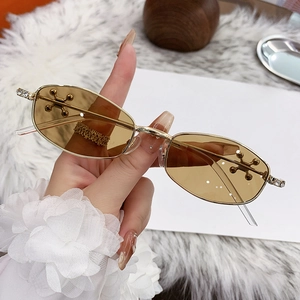 Stylish gold metal polygon sunglasses with brown lenses and diamond accents for women