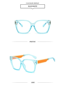 Detail view of square blue frames with stylish orange contrast blocks on temples