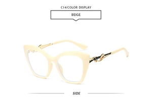Vue latérale de lunettes œil de chat beige avec branches élégantes en métal ajouré