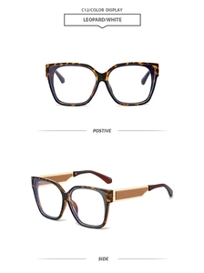 Detail of square leopard print eyewear frames with gold metal temple accents