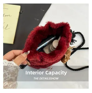 Interior view of red faux fur bucket bag showing storage capacity for phone and cosmetics