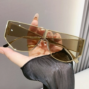 Fashionable oversized gold metal frame sunglasses with brown lenses for stylish women