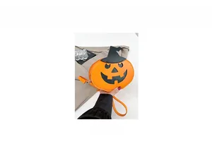 Close-up of Jack-o'-lantern pumpkin bag with black witch hat detail and orange strap