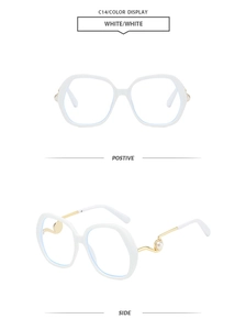 Detail view of round oversized eyewear frame with pearl accents and wavy gold metal temples
