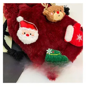 Detail of red faux fur Christmas drawstring bag with Santa and reindeer embroidery
