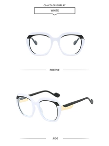 Detail view of white polygon frames with black browline and gold accented temples