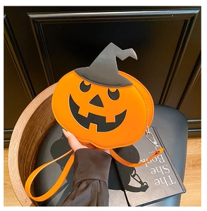 Detail of Halloween pumpkin crossbody bag with witch hat design and adjustable strap