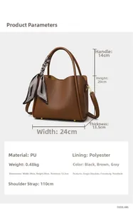 Close-up of brown litchi pattern PU tote bag with striped scarf and metal rivets