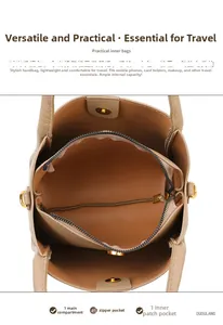 Interior view of khaki leather bucket bag showing organized compartments and magnetic closure
