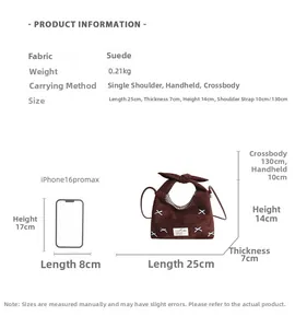 Detailed size comparison of the brown suede crossbody bag with an iPhone 16 Pro Max