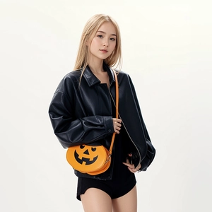 Fashionable orange pumpkin shaped shoulder bag with black face print for Halloween