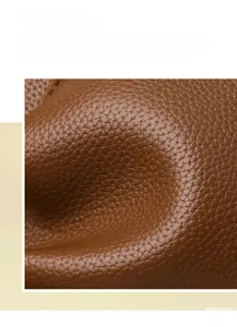 Close-up of premium brown litchi pattern leather texture with matte finish on bucket bag