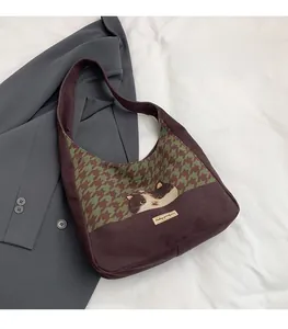 Detail of canvas tote bag with green houndstooth pattern and calico cat print