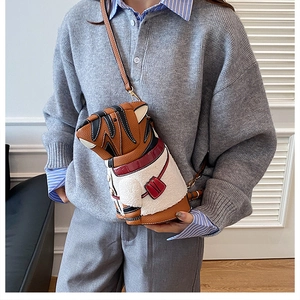 Detailed view of animal-shaped bucket bag featuring brown leather and white faux fur texture