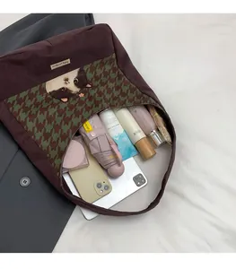 Interior view of brown canvas tote showing spacious storage for tablet and daily items