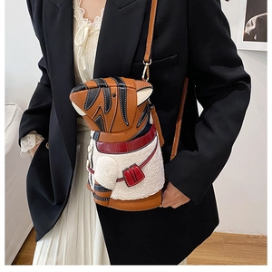 Detail of creative tiger-shaped bucket bag with textured faux fur and brown leather trim