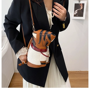 Close-up of animal-shaped bucket bag with tiger stripes and white fleece accent