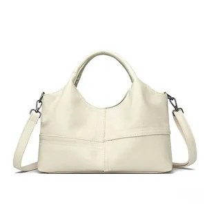 Detail of off-white PU leather bag showing fine lychee texture and cross stitching design