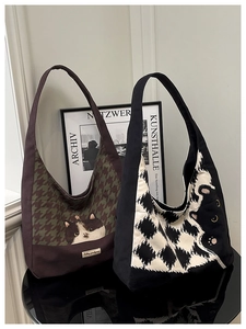 Close-up of canvas tote bags featuring artistic cat prints and stylish patterns