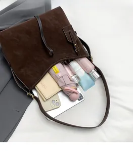 Top view of brown leather tote bag interior showing spacious capacity for daily essentials