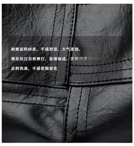 Macro close-up of premium black lychee texture leather with durable neat stitching