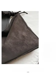 Close-up of deep brown vintage textured faux leather tote with drawstring details