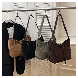 Detail showing various colors and matte texture of large tote bags on display